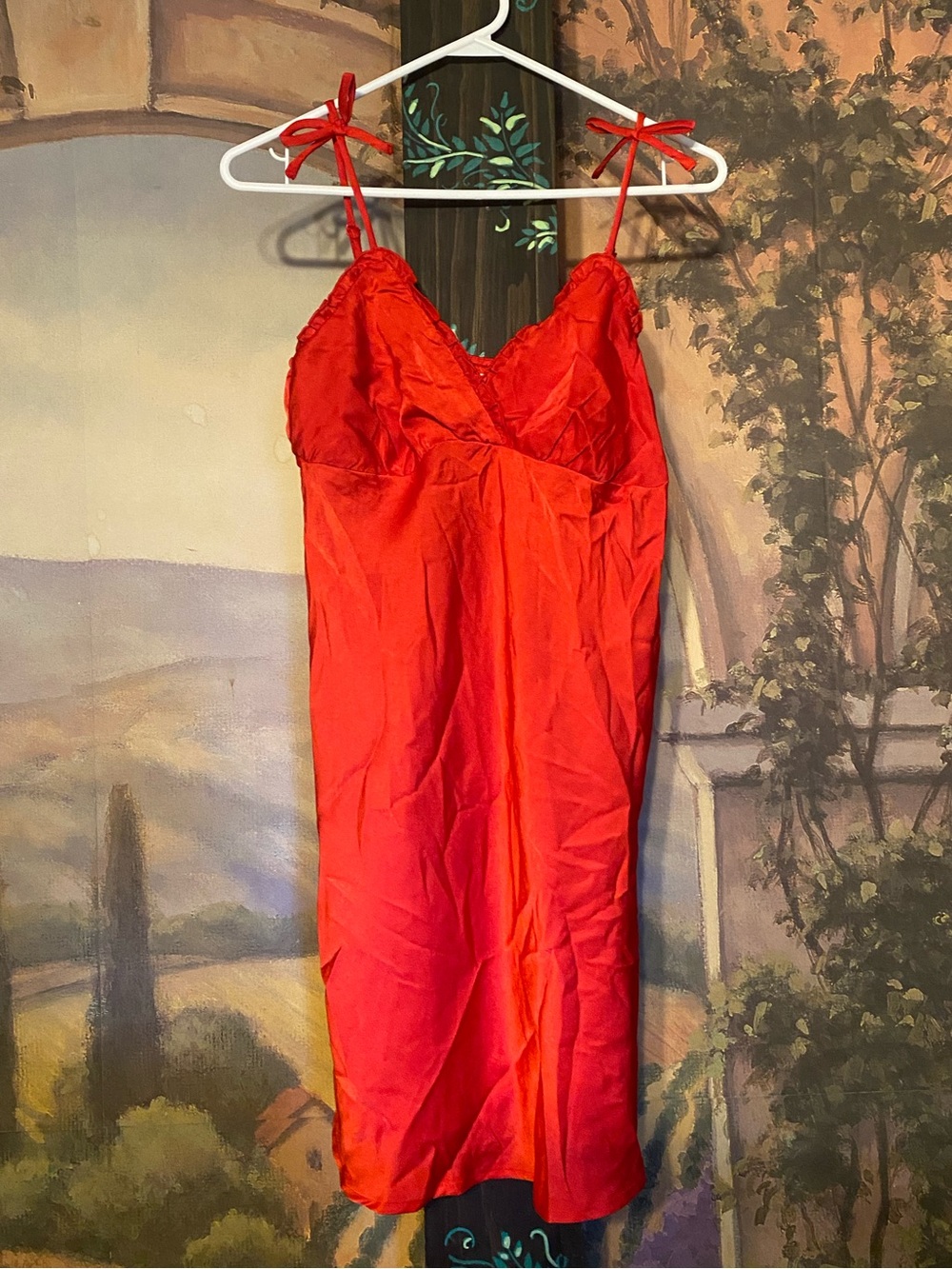 Red slip dress with bow accents
